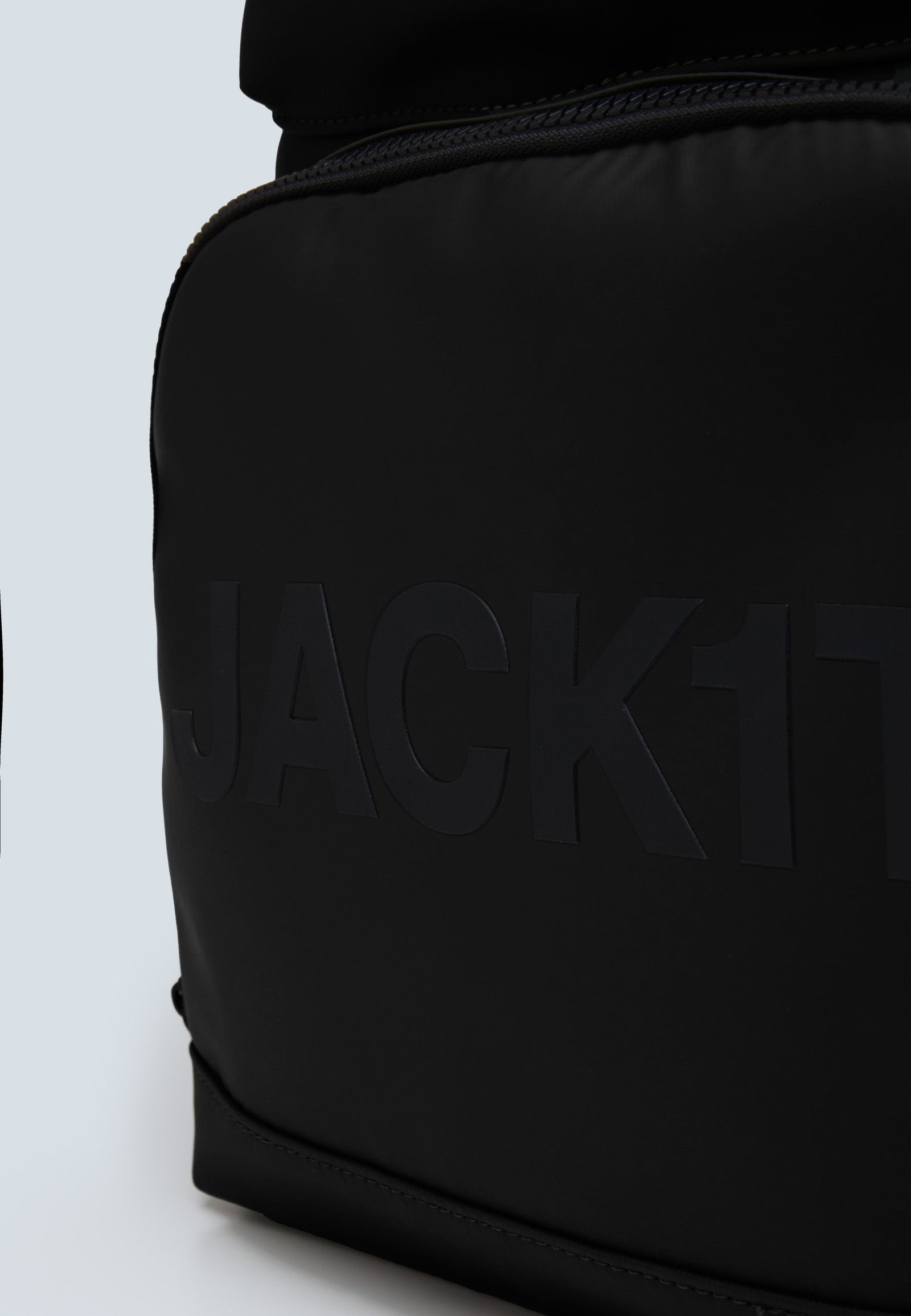 JACK1T's black water resistant backpack close-up showing the logo and sleek design.