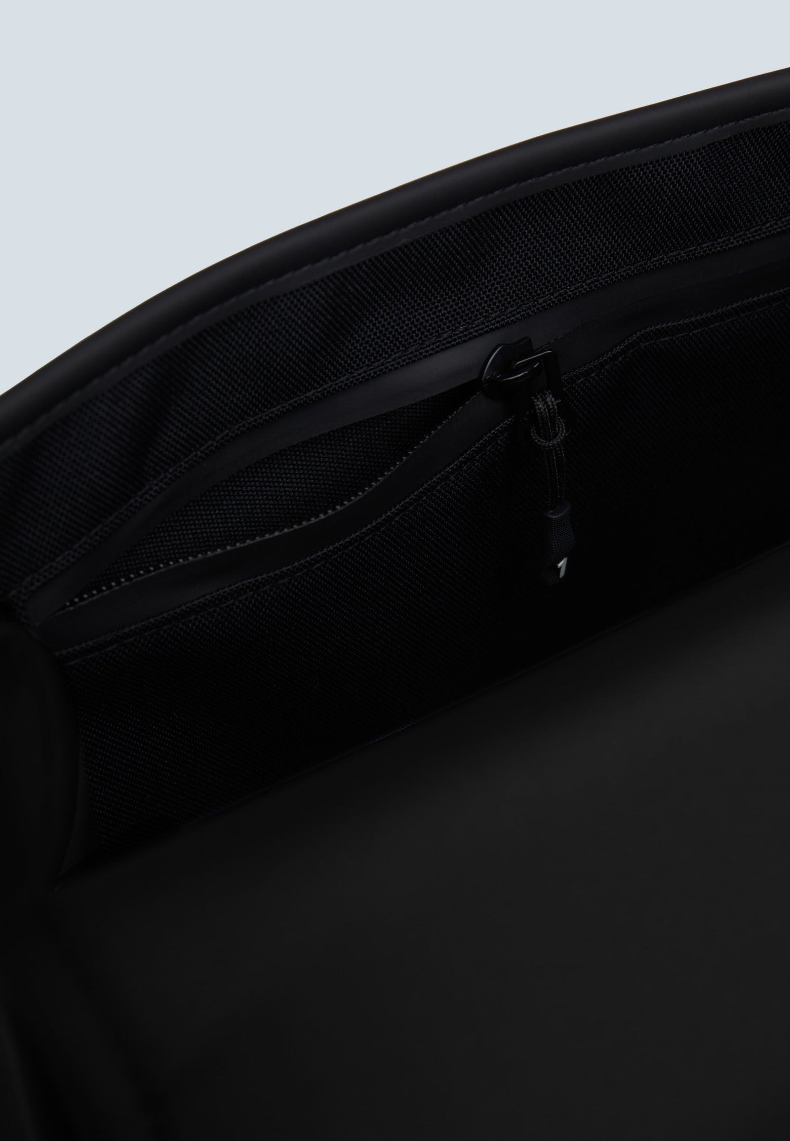 Interior pocket view of The JACK1T slim messenger laptop bag in black, highlighting its practical design and organization.