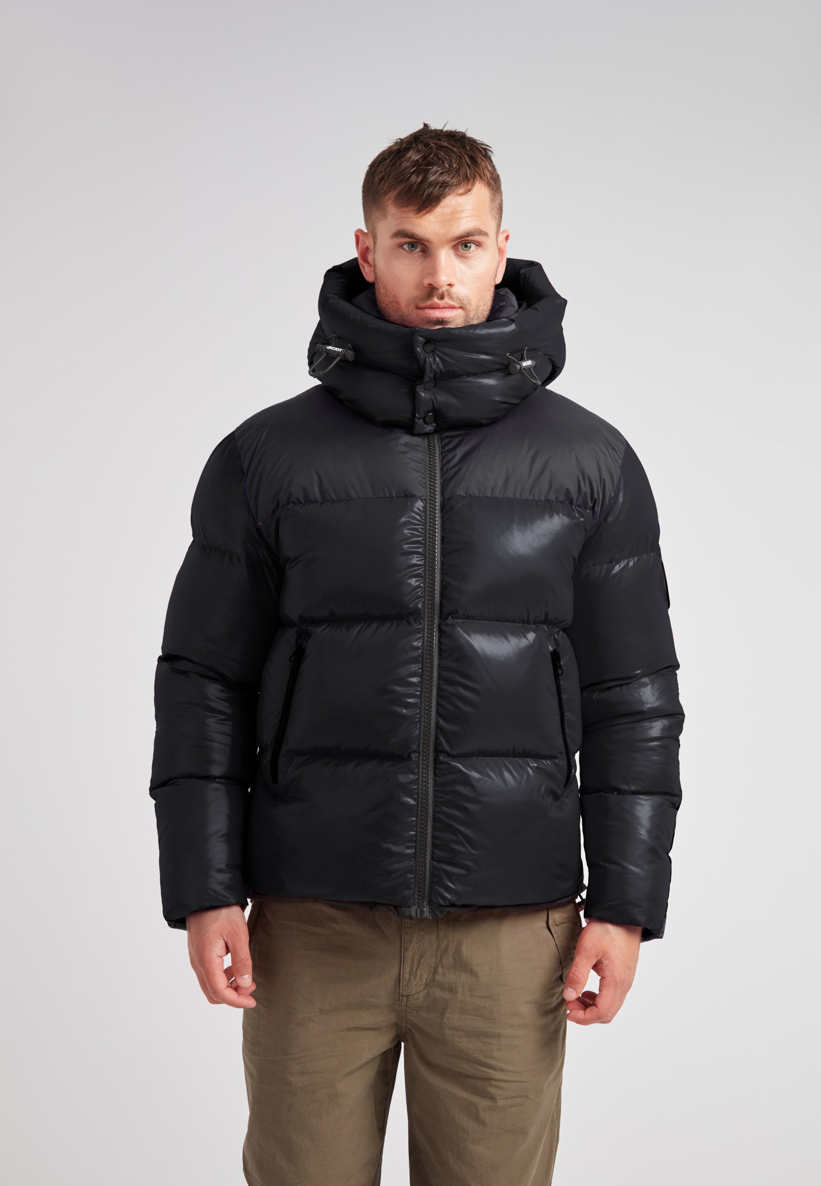 Expedition Parka Puffer Men Black worn by a model, showcasing its boxy silhouette and oversized hood.