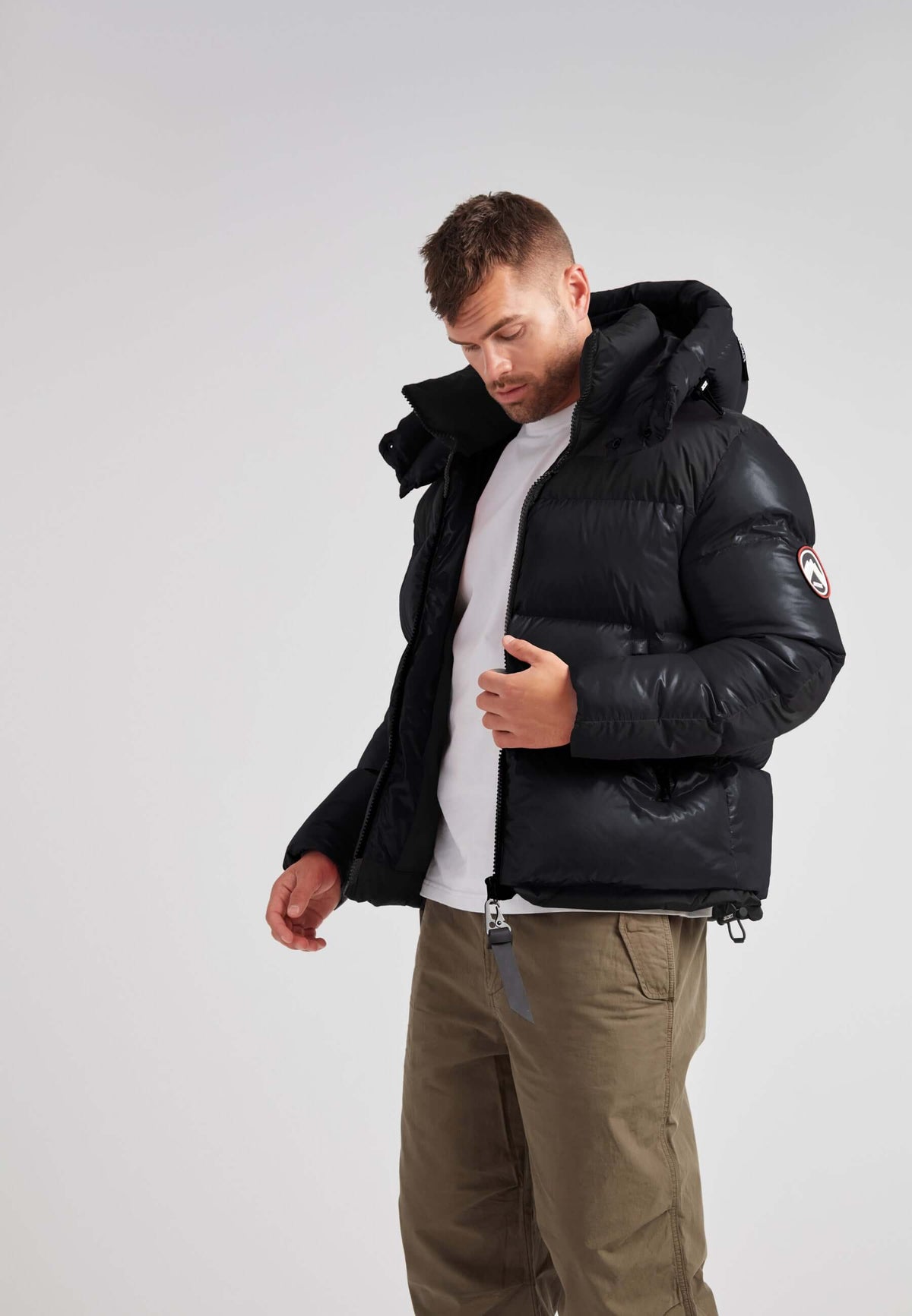 Expedition Parka Puffer Men Black model wearing oversized black puffer jacket with hood