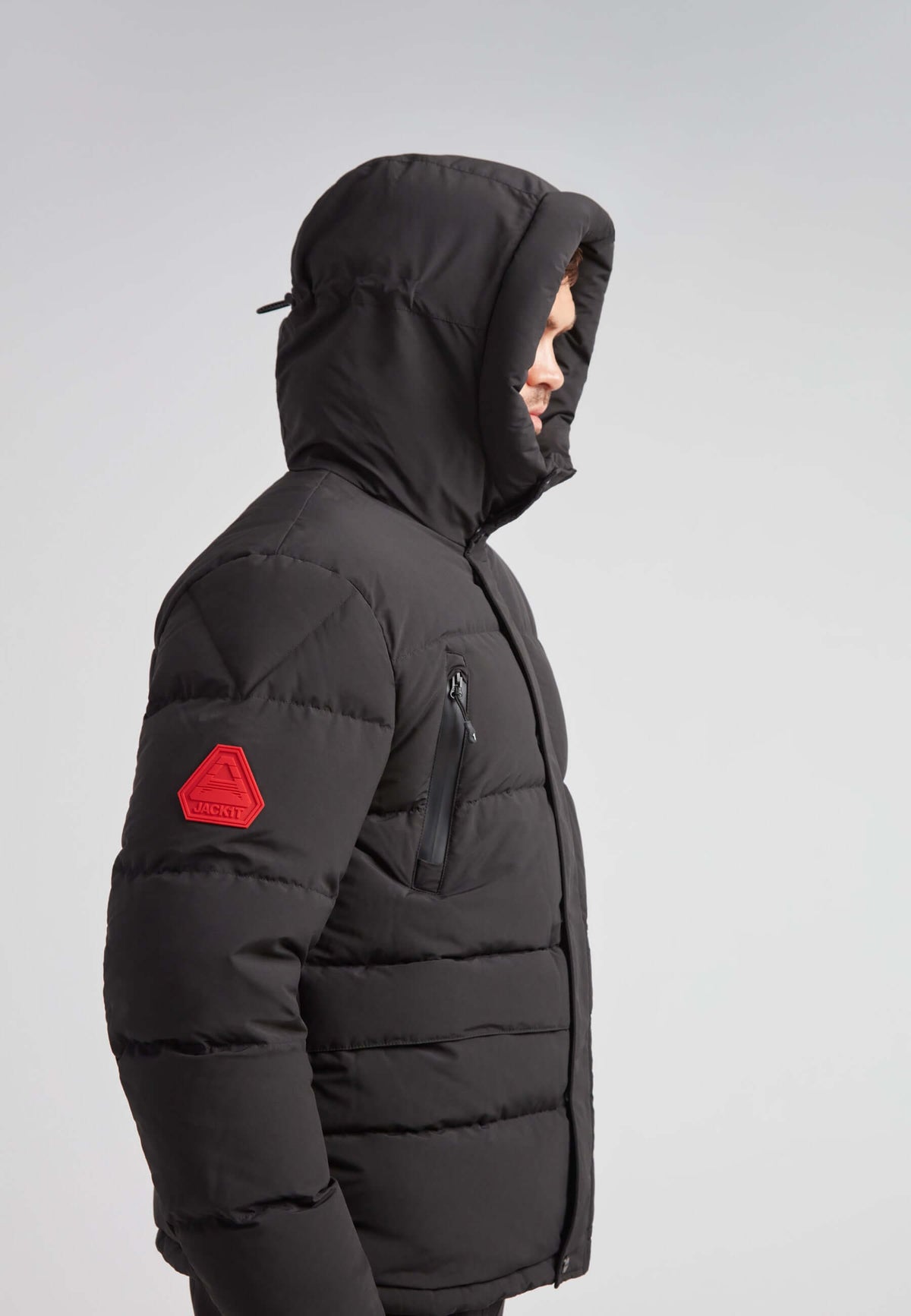 EZ Frontier Prime Down Puffer Jacket Matt Black side view with hooded design and red patch detail