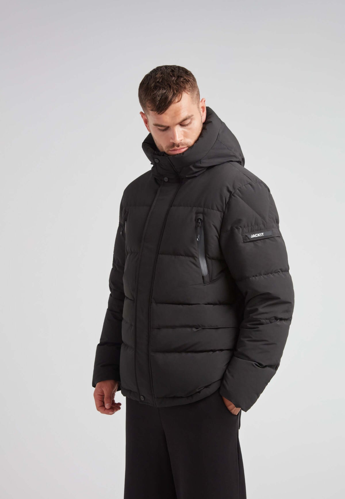 EZ Frontier Prime Down Puffer Jacket Matt Black worn by a model showing modern silhouette and winter utility features.