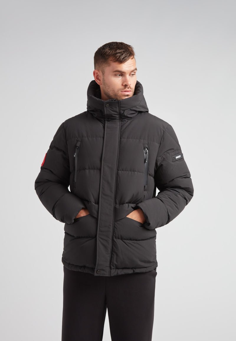 EZ Frontier Prime Down Puffer Jacket Matt Black worn by a model, showcasing modern urban winter style and functionality.