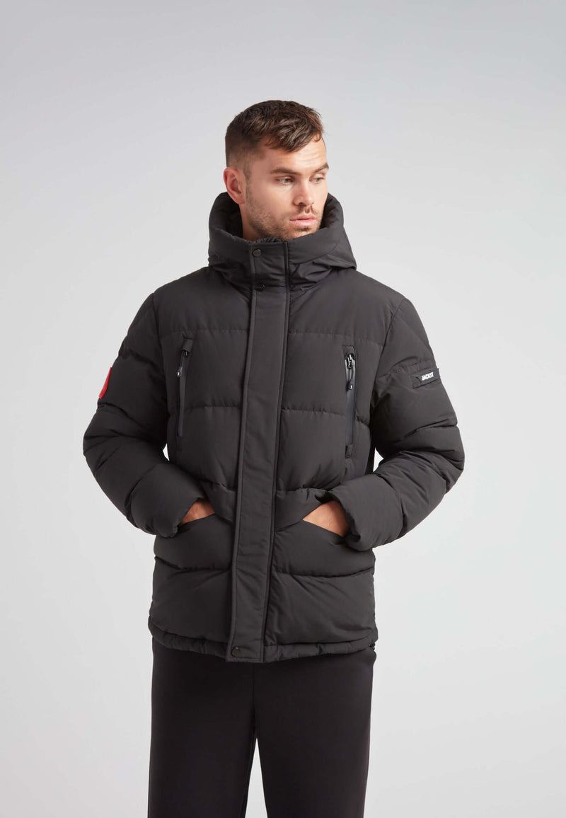 EZ Frontier Prime Down Puffer Jacket Matt Black worn by a model, showcasing modern urban winter style and functionality.