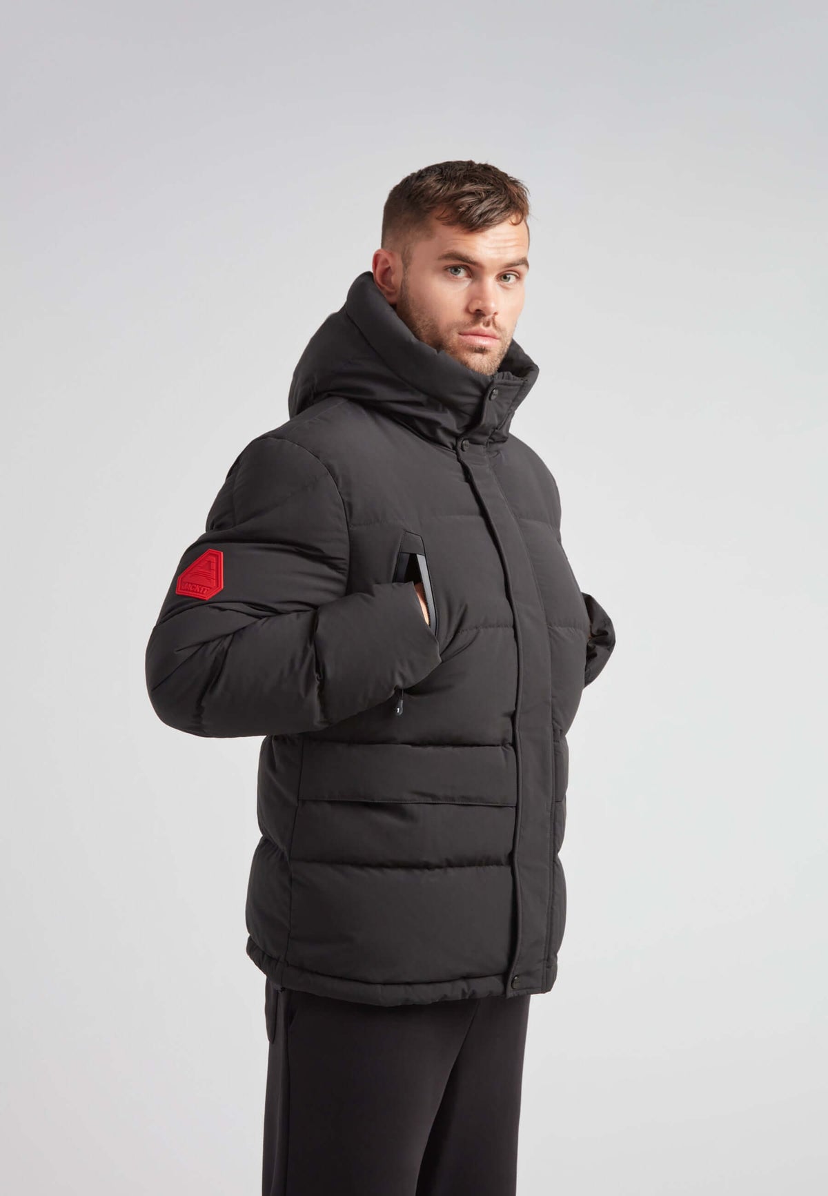 EZ Frontier Prime Down Puffer Jacket Matt Black on model with a modern fit and hood, featured in a sleek design.