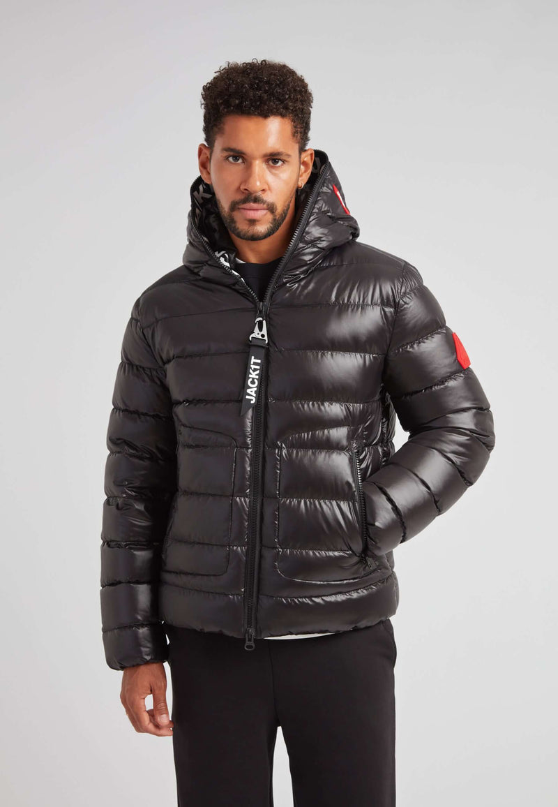R4D Tramline Puffer Racer Jacket Lux Black on model in sleek black with hood, showcasing modern technical outerwear design.