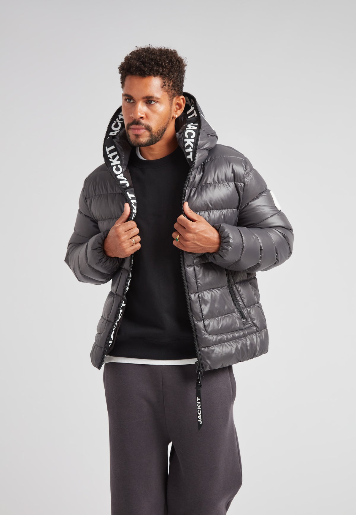 R4D Tramline Puffer Racer Jacket Lux Graphite model showcasing urban style and warmth.