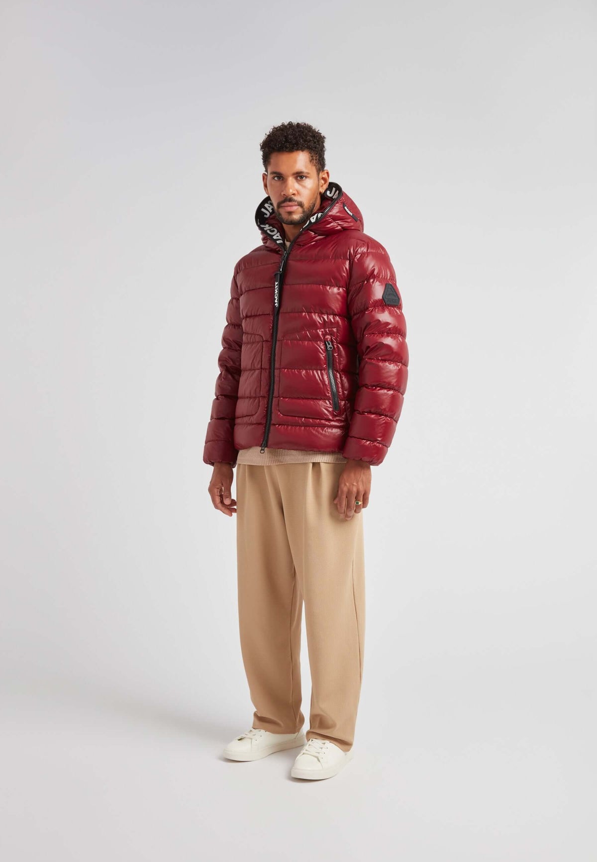 R4D Tramline Puffer Racer Jacket Lux Red worn by a model, showcasing its sleek design and vibrant color.