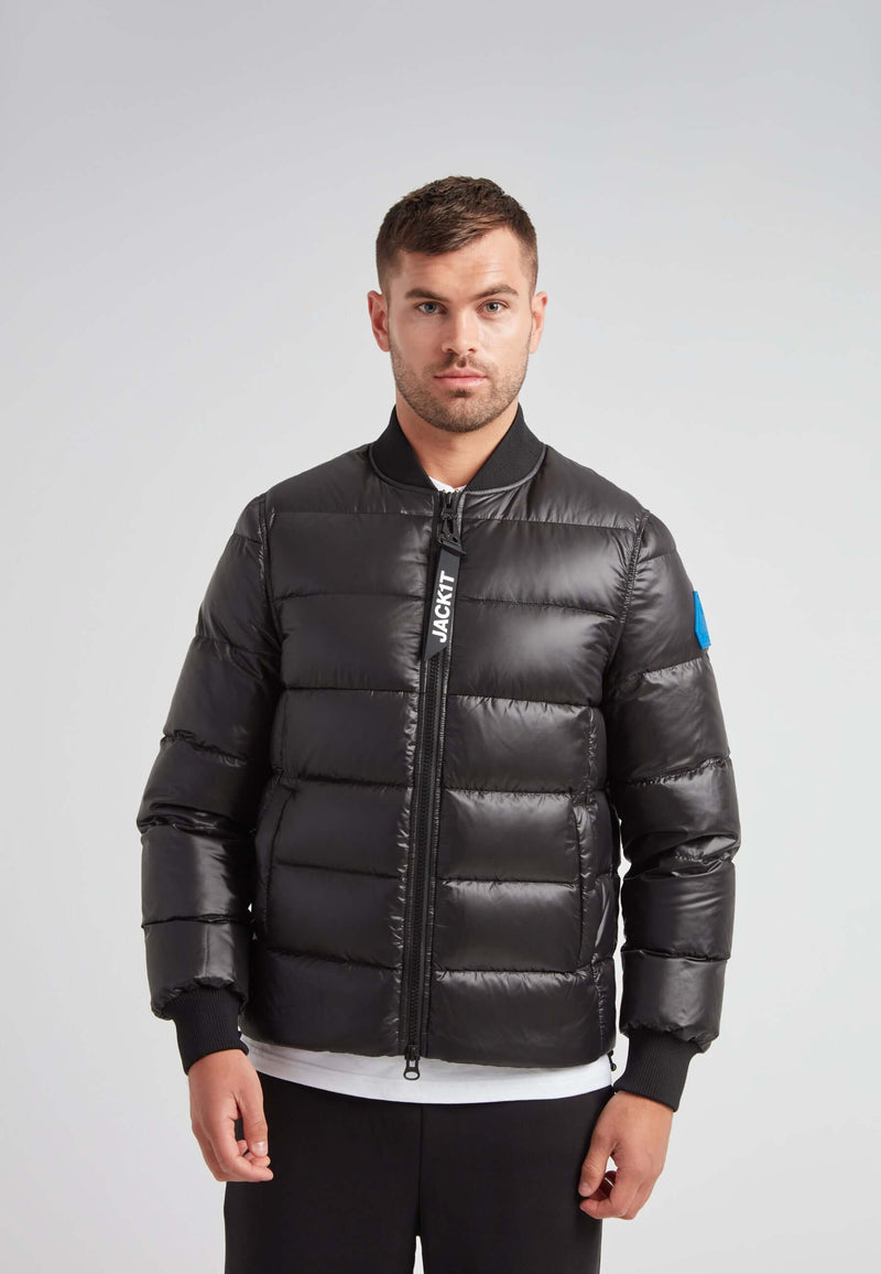 Man wearing a Vortex Black Bomber Jacket, showcasing modern outerwear style and high-performance features.