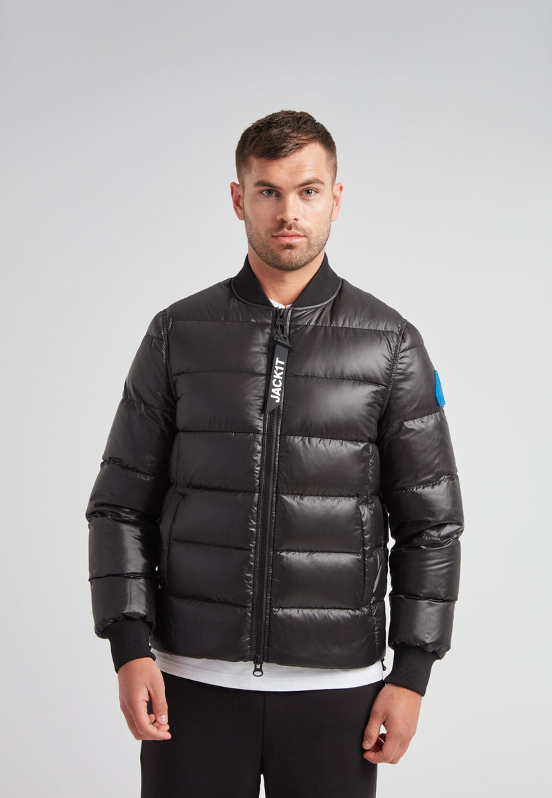 Man wearing a Vortex Black Bomber Jacket, showcasing modern outerwear style and high-performance features.