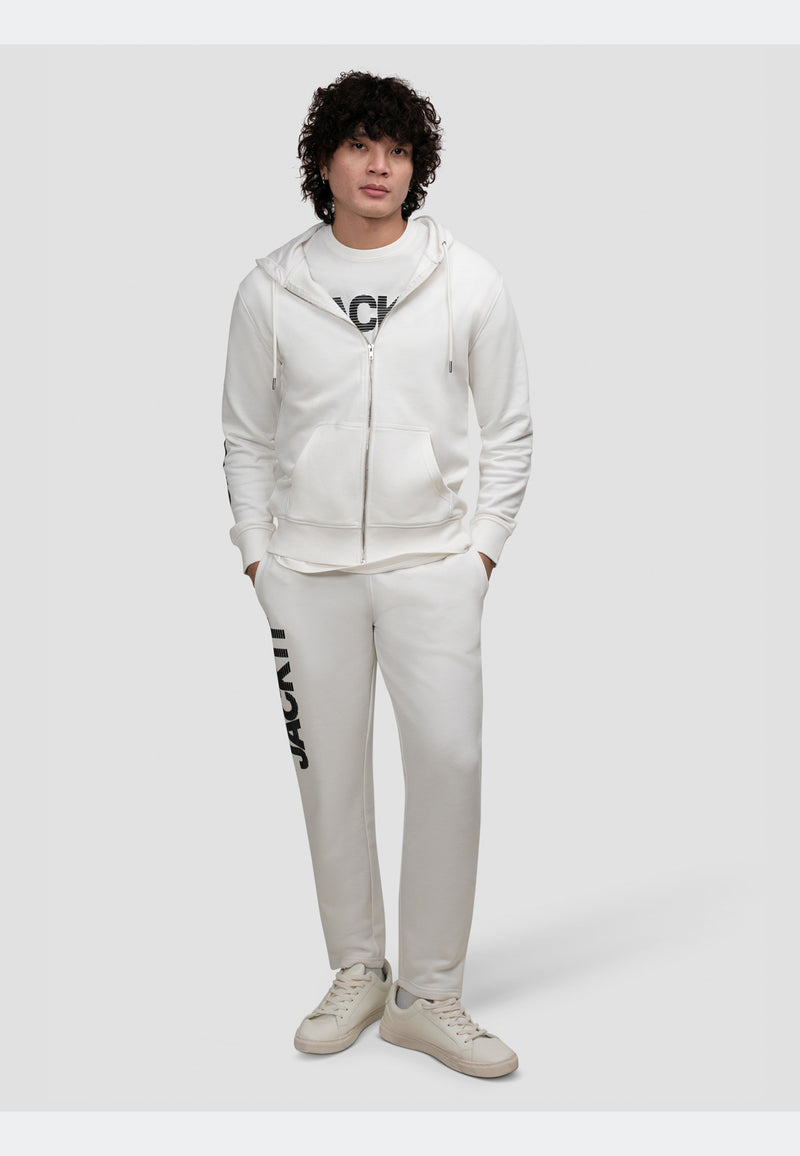 Off white joggers paired with a matching hoodie for a relaxed, stylish outfit.