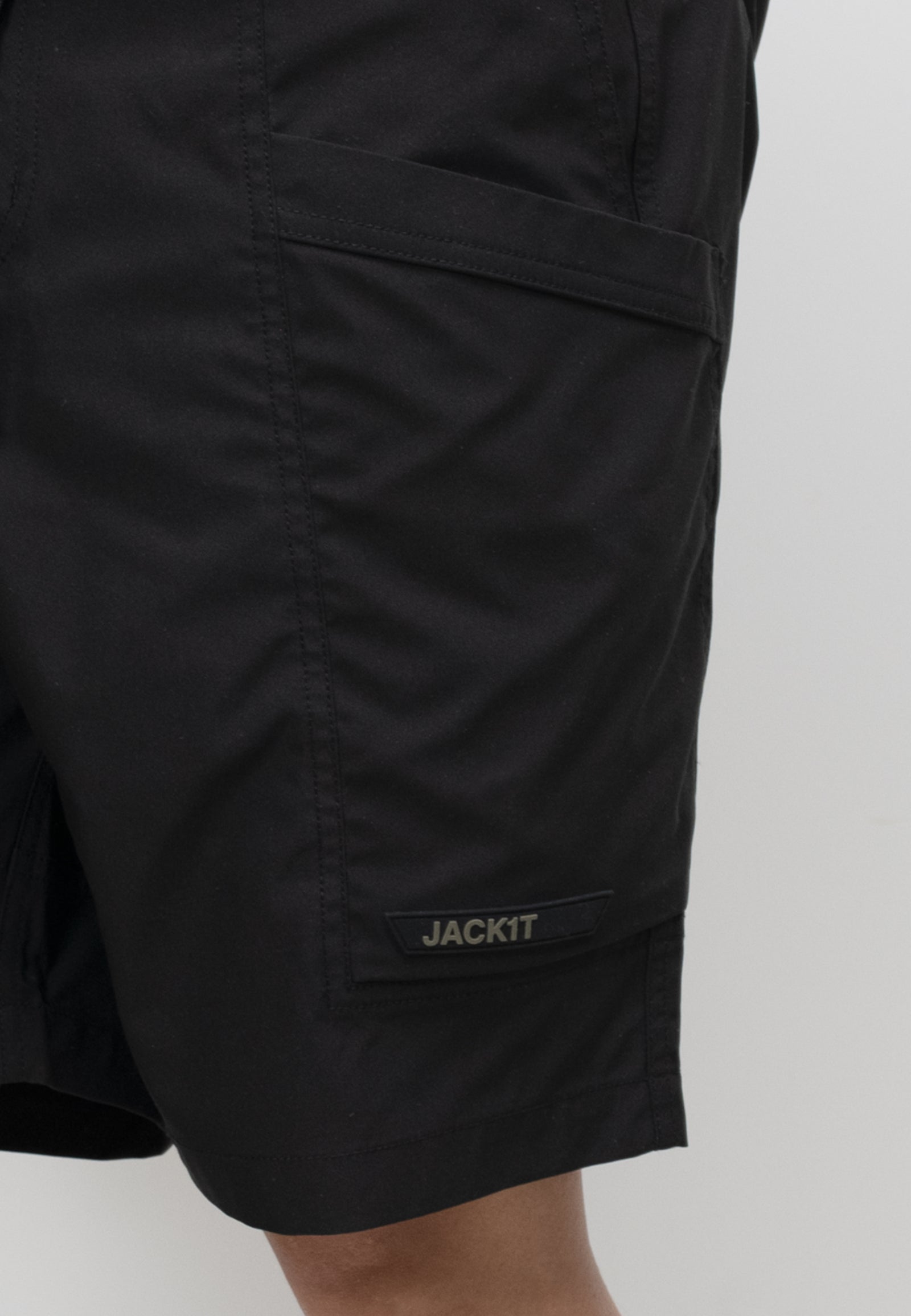 men's black summer shorts with pockets and JACKIT label, designed for lightweight comfort and relaxed fit.