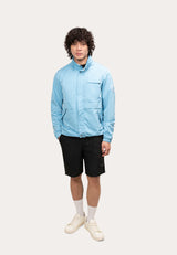 Model wearing a men's blue windbreaker in sky blue, showcasing a lightweight and functional design for spring and summer.