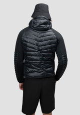 Back view of a man wearing the Mens Hybrid Black Hooded Jacket, showcasing the lightweight design and non-removable hood.