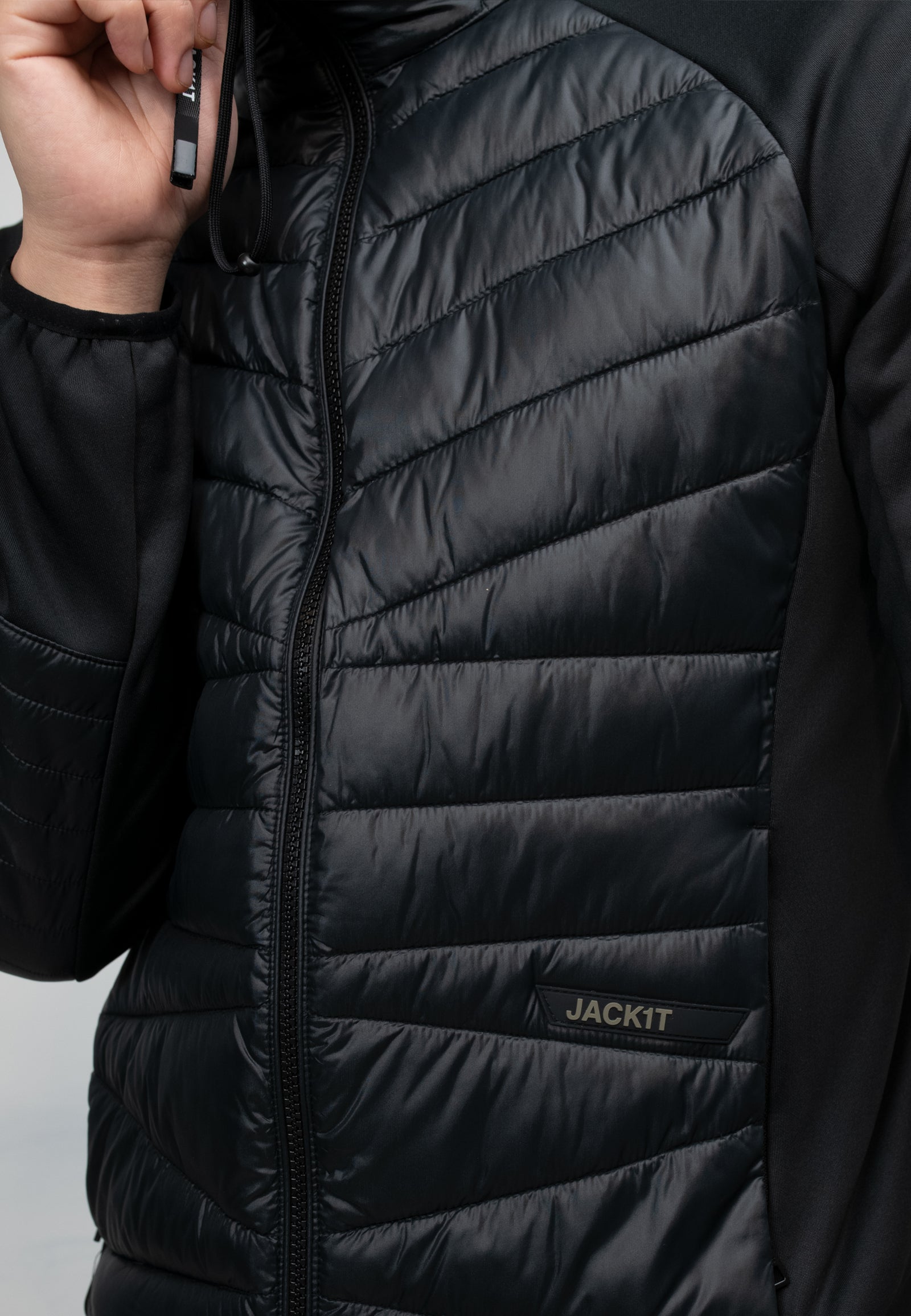 Men's black hooded jacket with THERMOLITE insulation and water-resistant features.