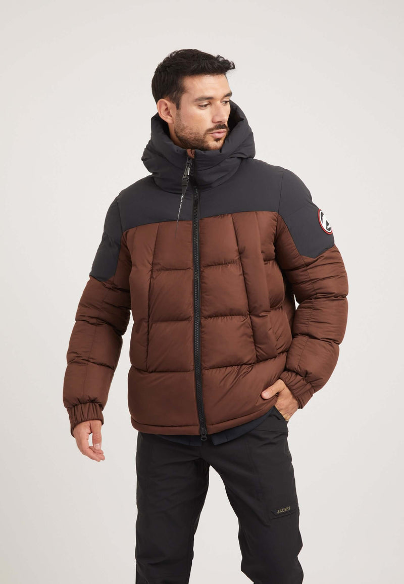 Model wearing Luna Puffer Jacket in mid brown and black, showcasing style and functionality of the mens brown puffer jacket.