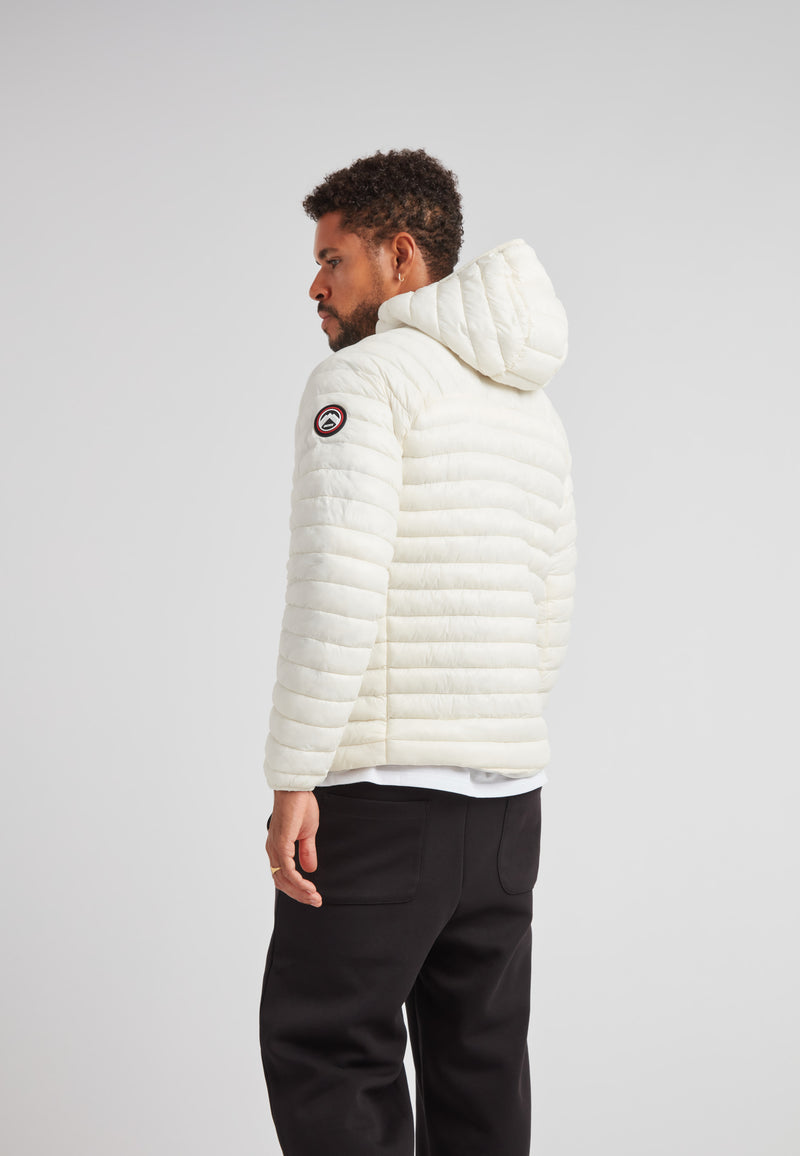 Back view of a man wearing the SATEL1TE Hooded Jacket 2.0 in white, showcasing its stylish and compact design.
