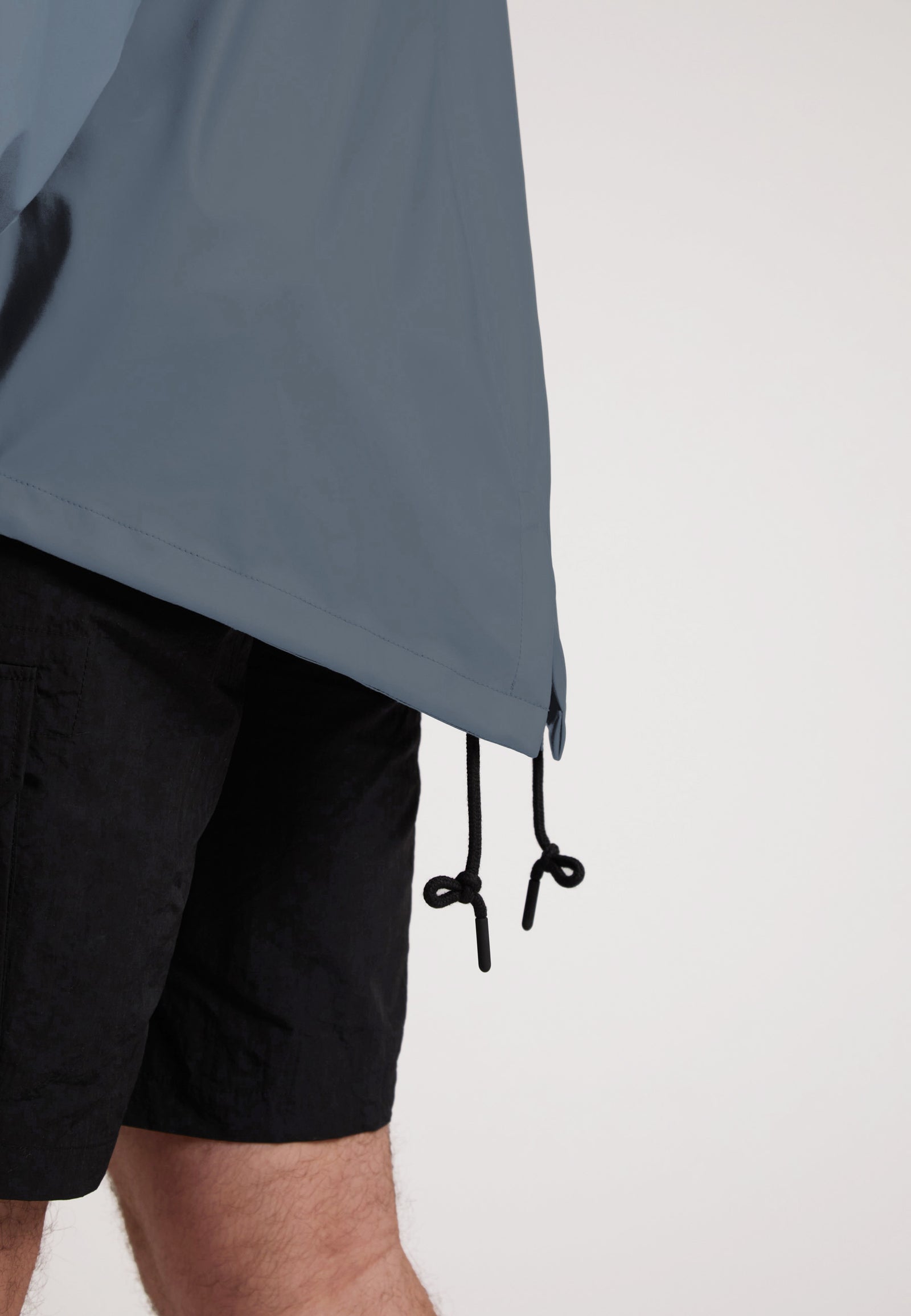 ELEMENTS Unisex Raincoat 2.0 Grey showcasing adjustable drawstrings and lightweight design in a close-up view.