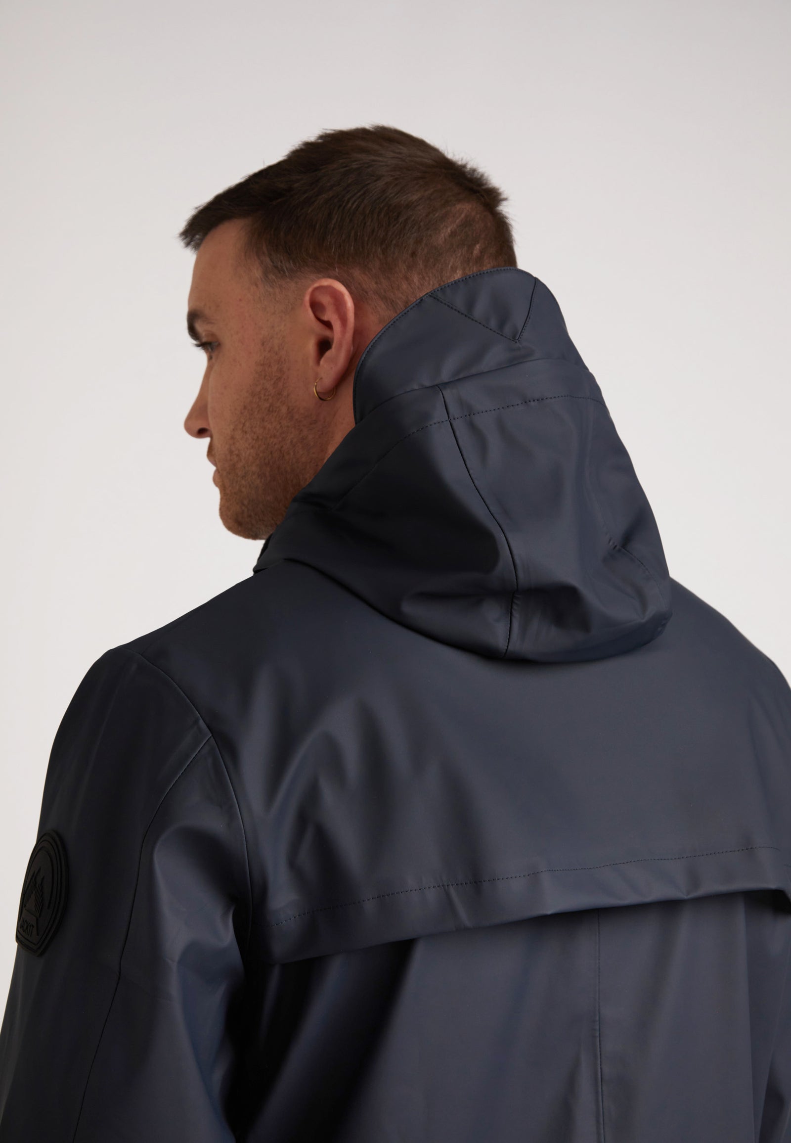 ELEMENTS Unisex Raincoat 2.0 Navy shown from behind, highlighting its sleek design and hood.
