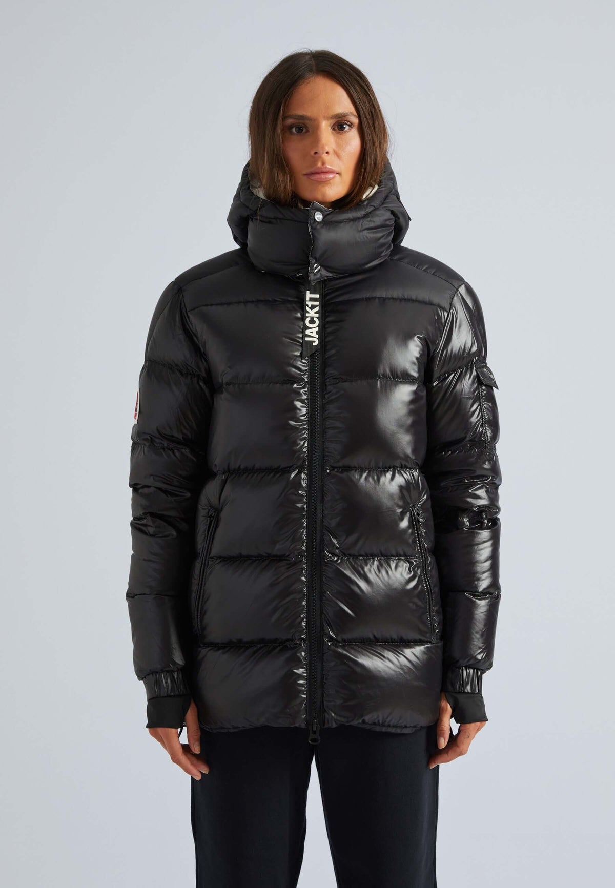 women's black puffer with removable hood featuring a funnel neck and stylish design.