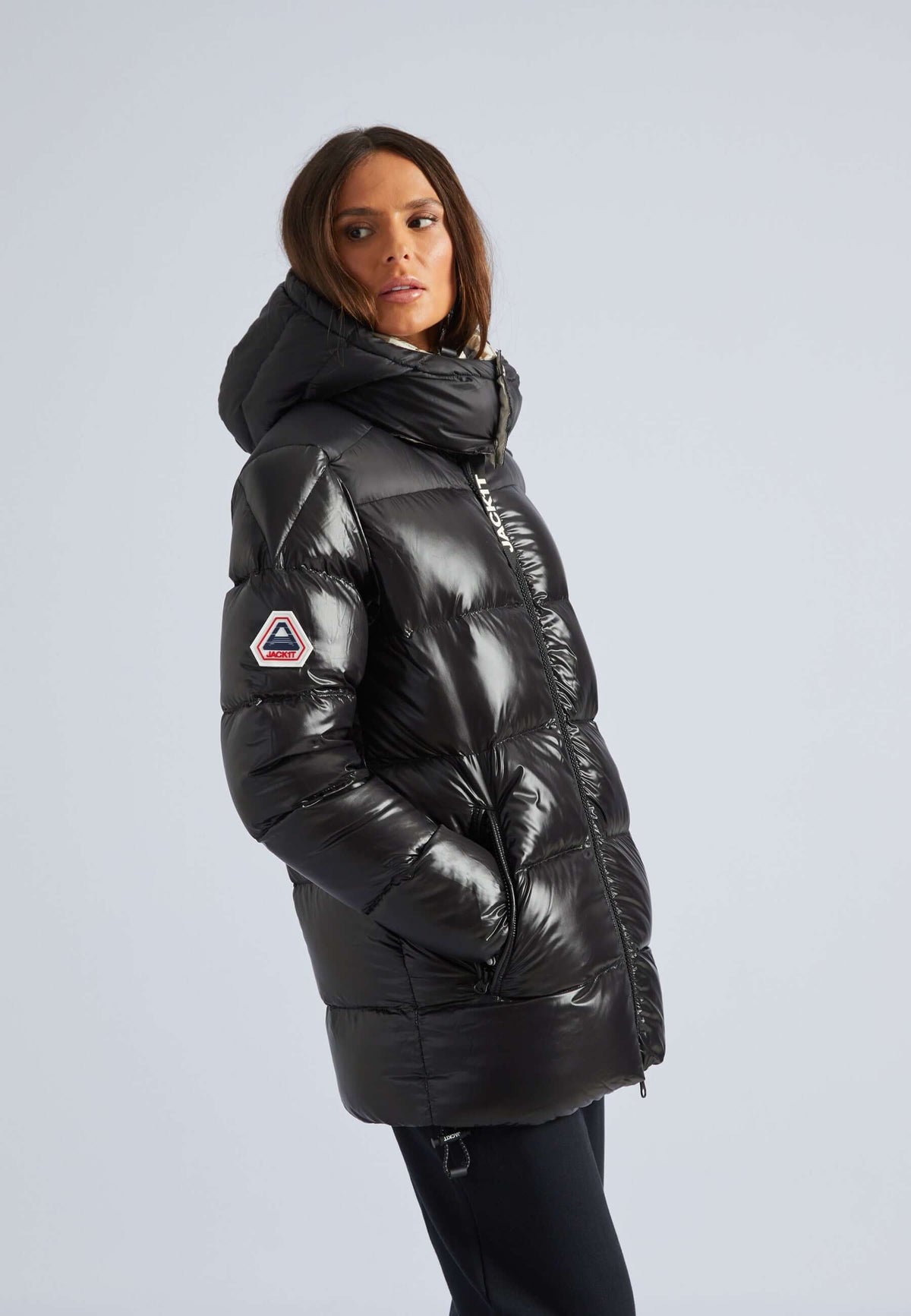 women's black puffer with removable hood, lightweight and stylish for cold weather.