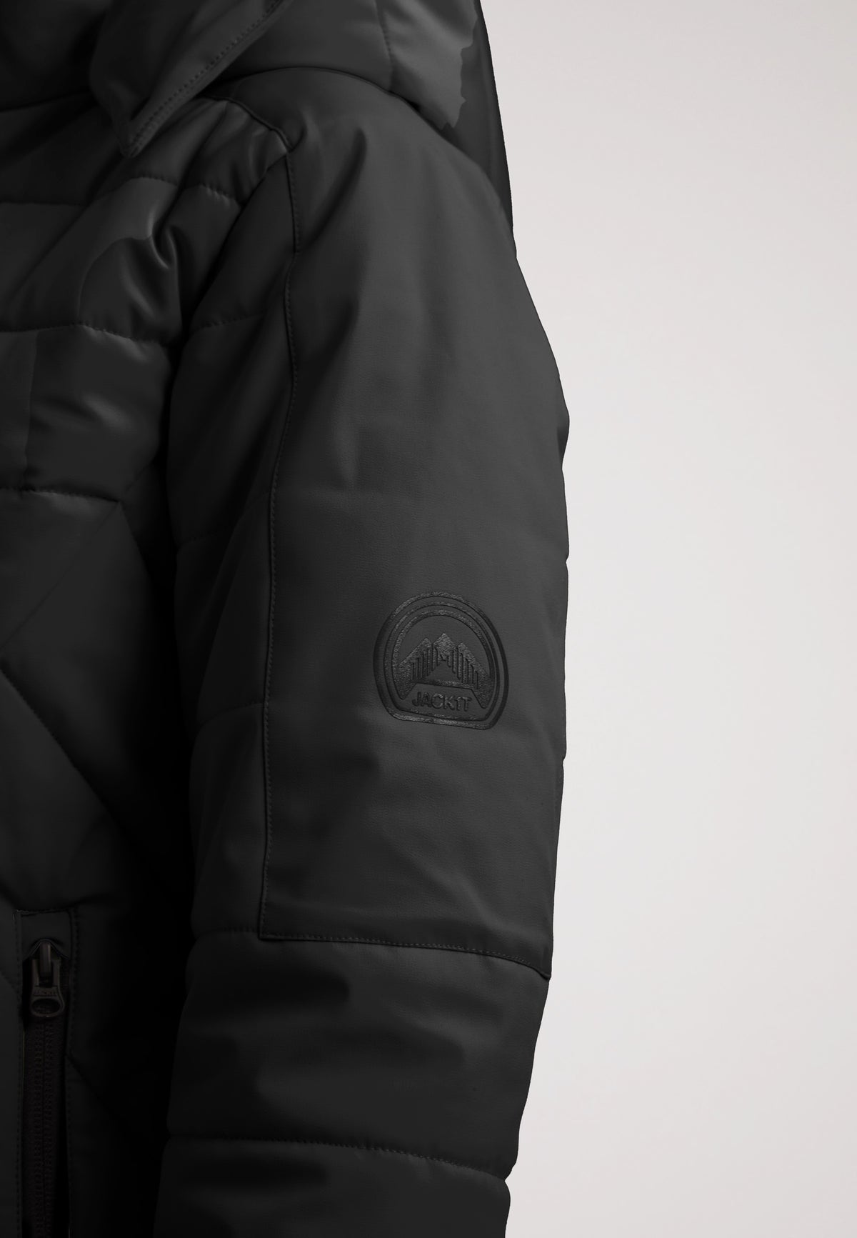 ISOTOPE Padded Jacket Black close-up showing sleeve detail and logo.