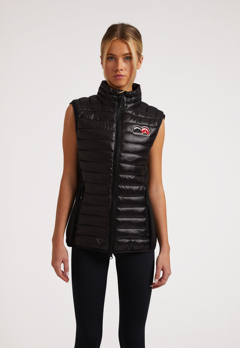 SPORTL1TE Funnel Lightweight Gilet 2.0 Lux Black worn by model, showcasing sleek design and lightweight performance.