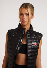 SPORTL1TE Funnel Lightweight Gilet 2.0 Lux Black worn by a model showcasing its sleek design and comfort.