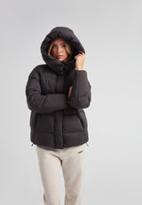 Model wearing a Cloud Prime Longline Down Puffer Jacket with hood, showcasing winter style and warmth.