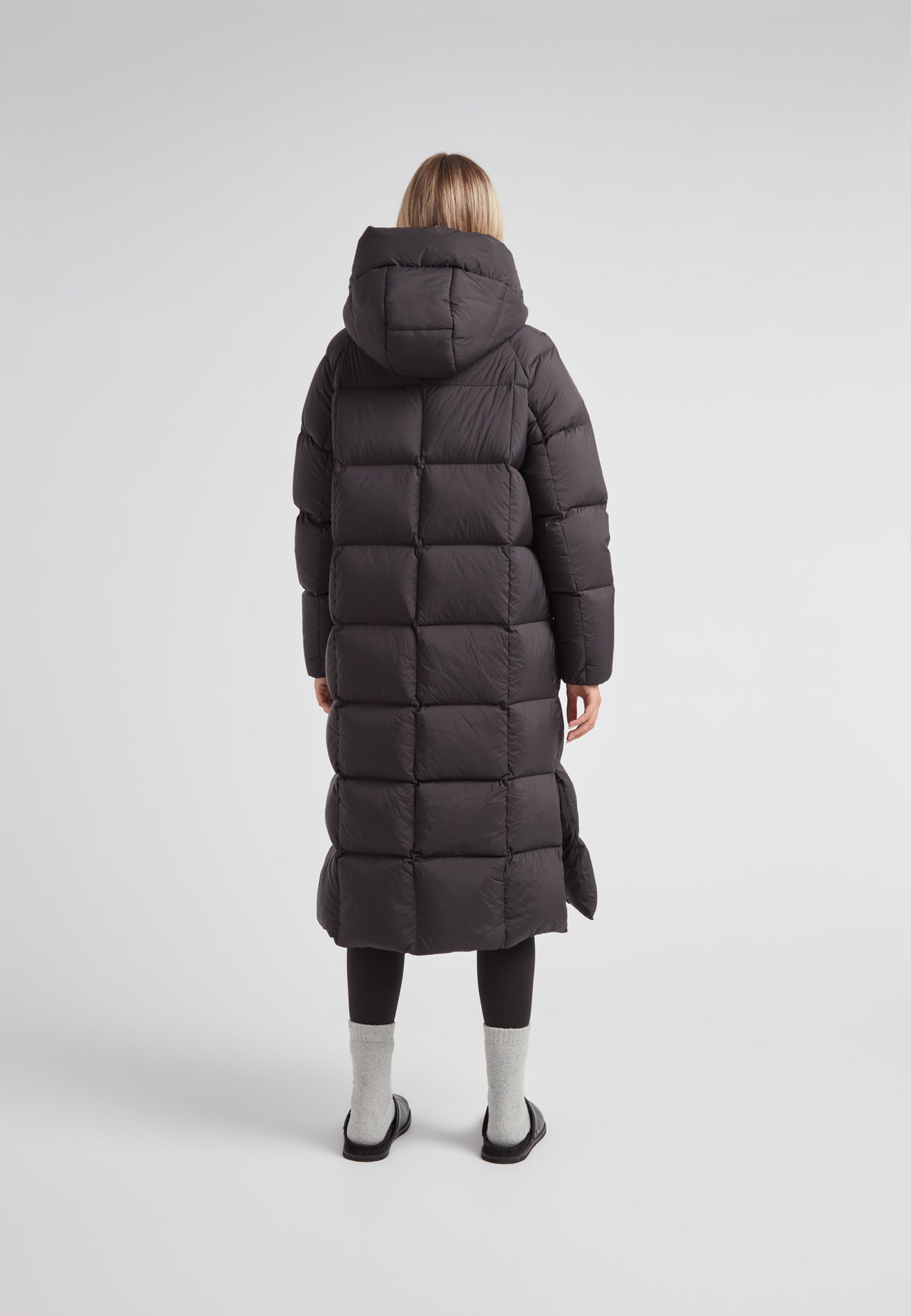 Back view of a woman wearing a Cloud Ultra Long Down Puffer Coat, showing the longest puffer jacket in black.