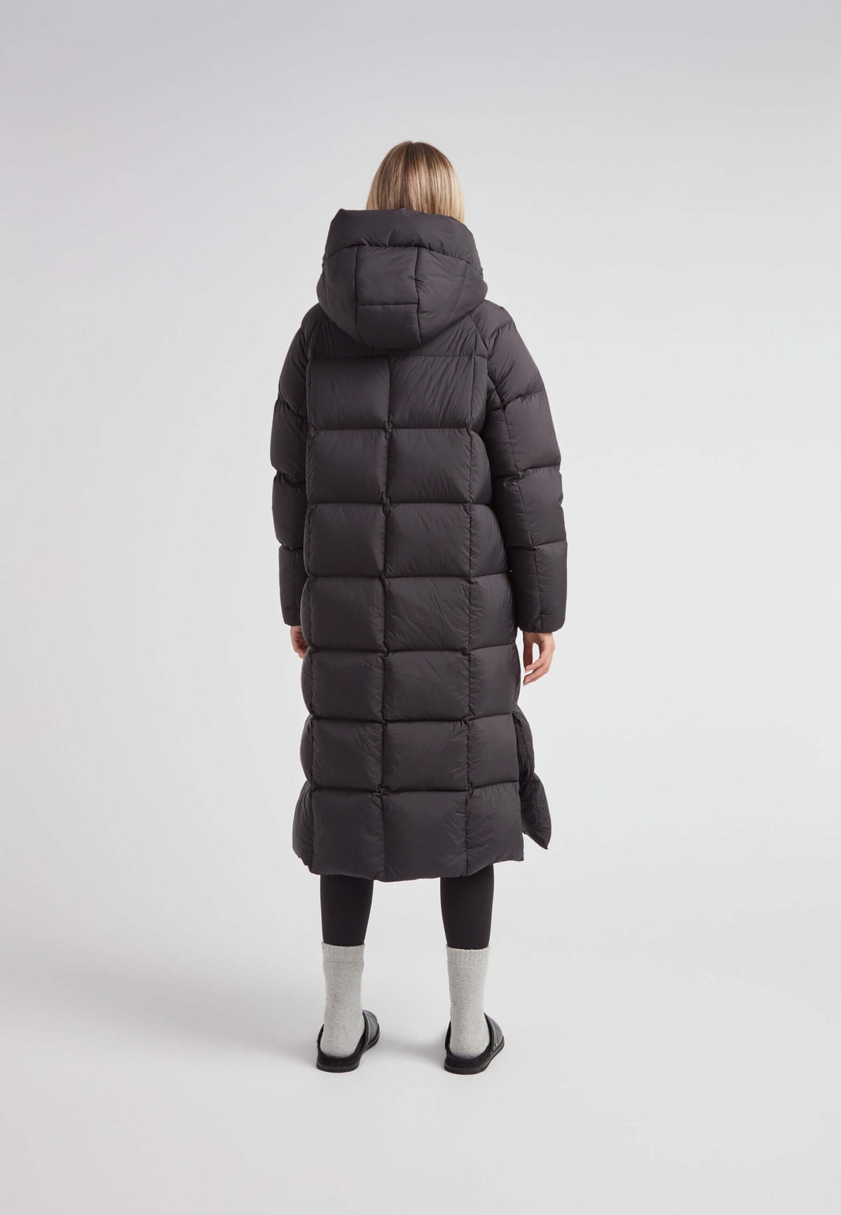 Back view of a woman wearing a Cloud Ultra Long Down Puffer Coat, showing the longest puffer jacket in black.