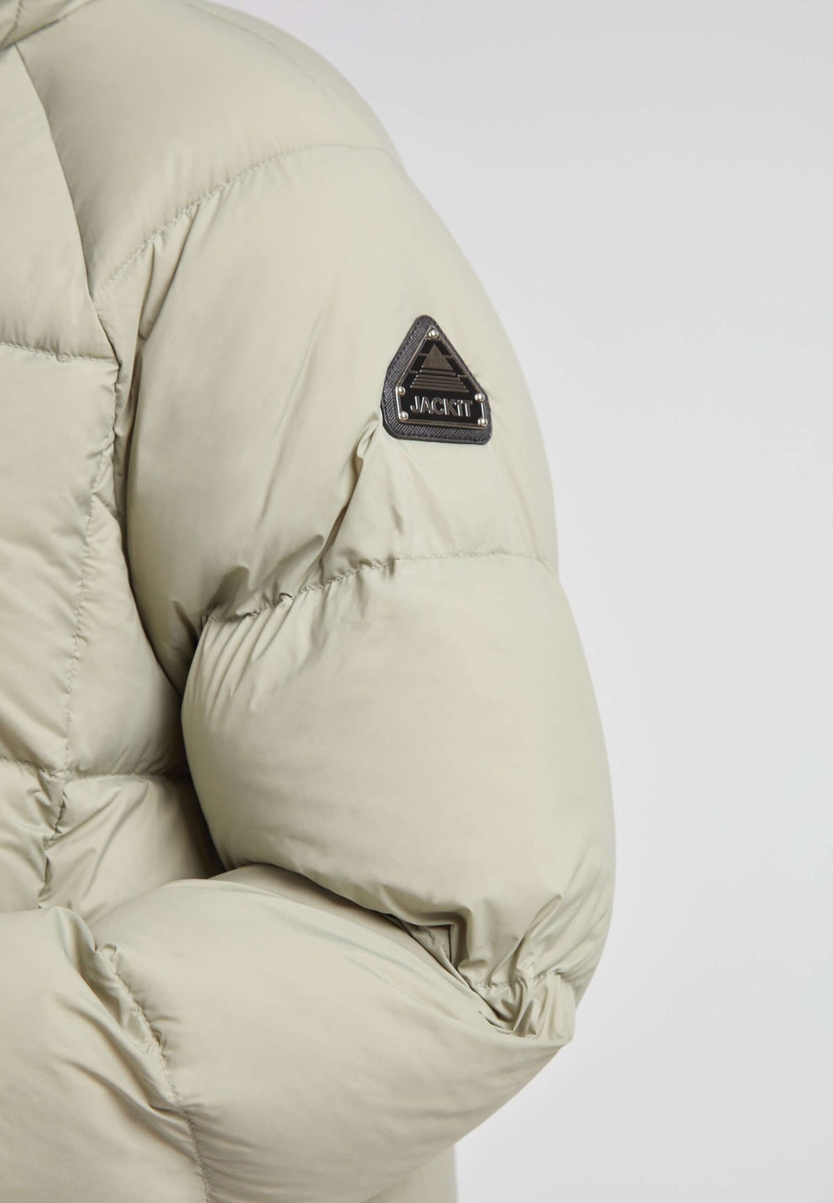 Close-up of the Cloud Ultra Long Down Puffer Coat highlighting the sleeve design and JACK1T logo.