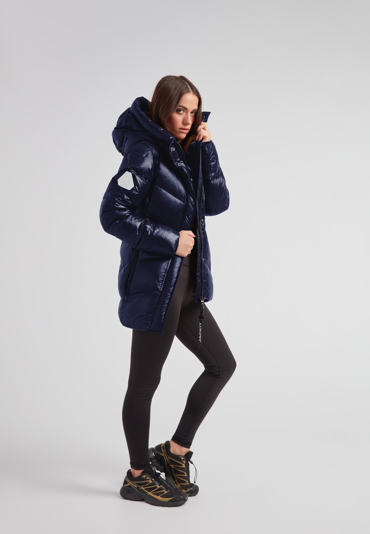 Womens navy down puffer coat featuring a sleek design and adjustable features for comfort and style.