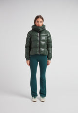Model wearing the EZ Boxed Crop Down Puffer Jacket Lux Emerald with matching green pants.