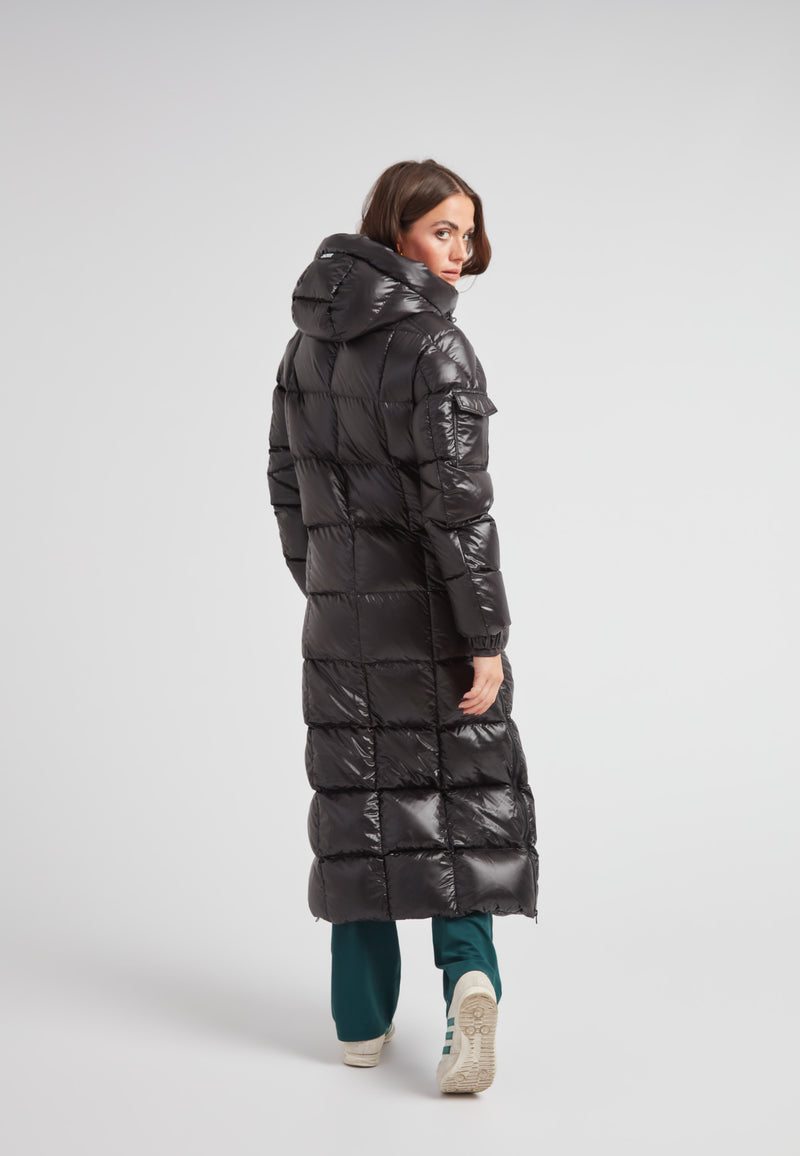 Woman wearing the EZ Boxed Ultra Long Down Puffer Coat Lux Black from the back, showcasing its sleek design and long length.