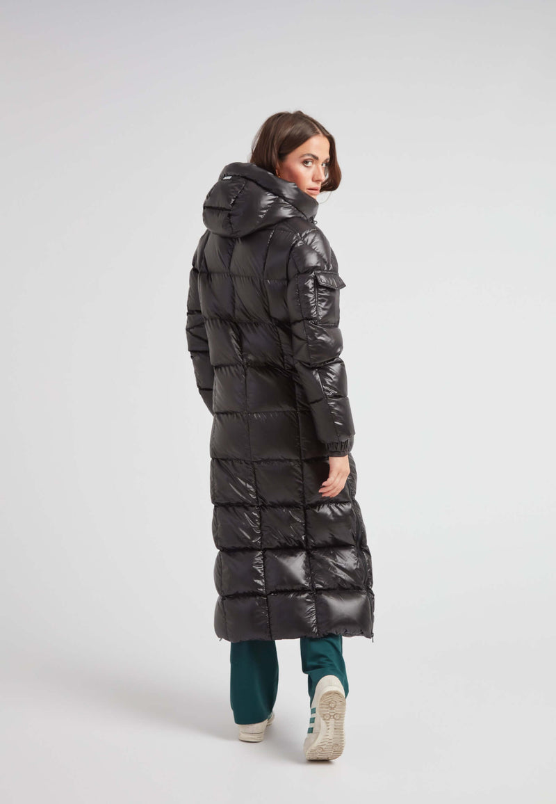 Woman wearing the EZ Boxed Ultra Long Down Puffer Coat Lux Black from the back, showcasing its sleek design and long length.