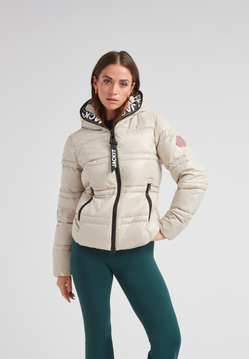 R4D Tramline puffer racer jacket lux stone worn by model, featuring a stylish hood and warm design.
