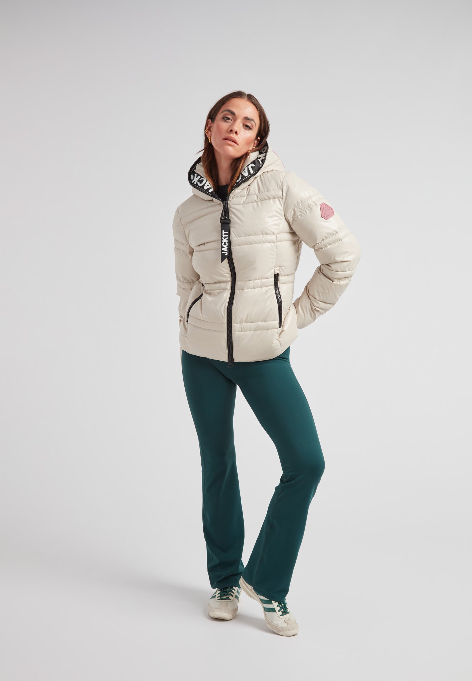 R4D Tramline puffer racer jacket lux stone worn by a model, showcasing its modern design and cozy fit.