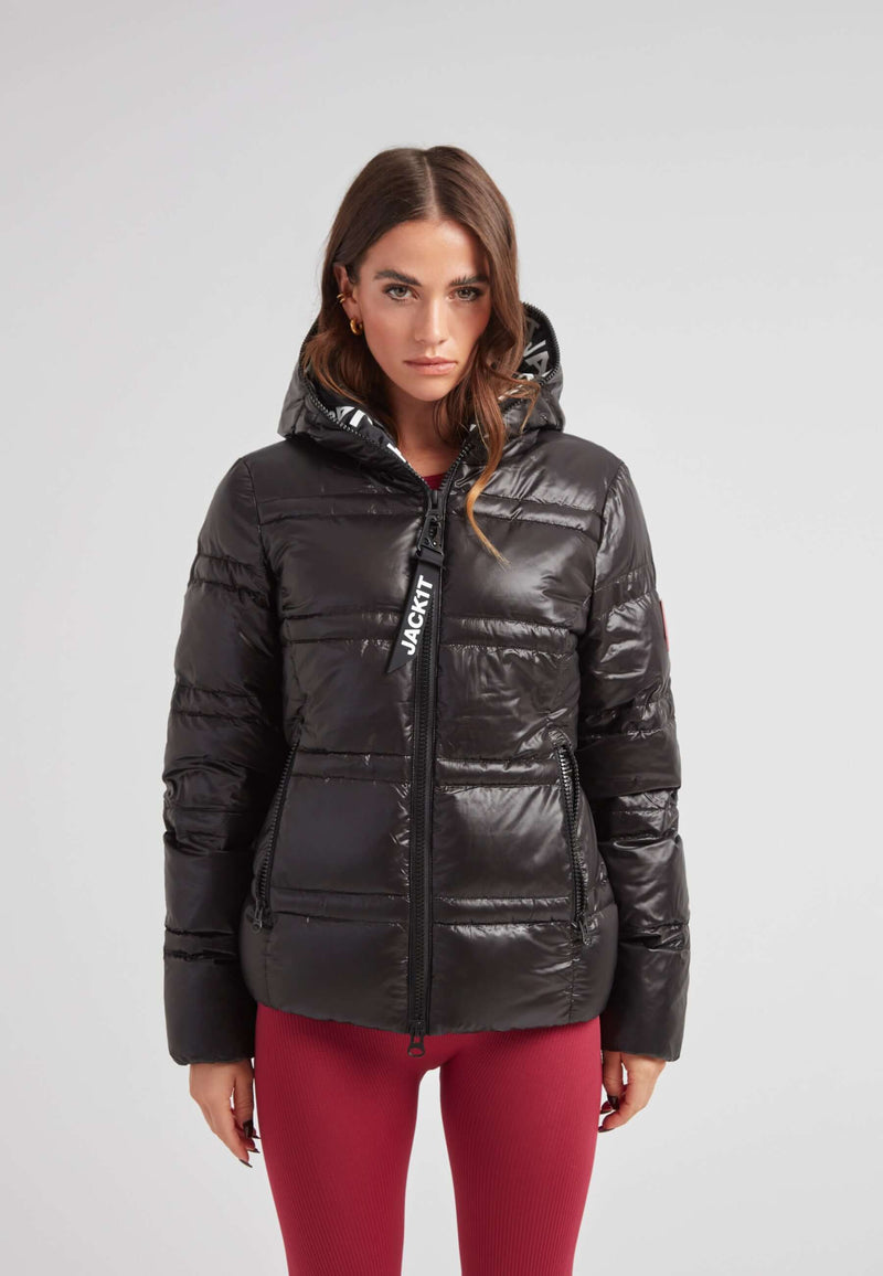 R4D Tramline Puffer Racer Jacket Lux Black worn by model, showcasing its sleek design and hood.