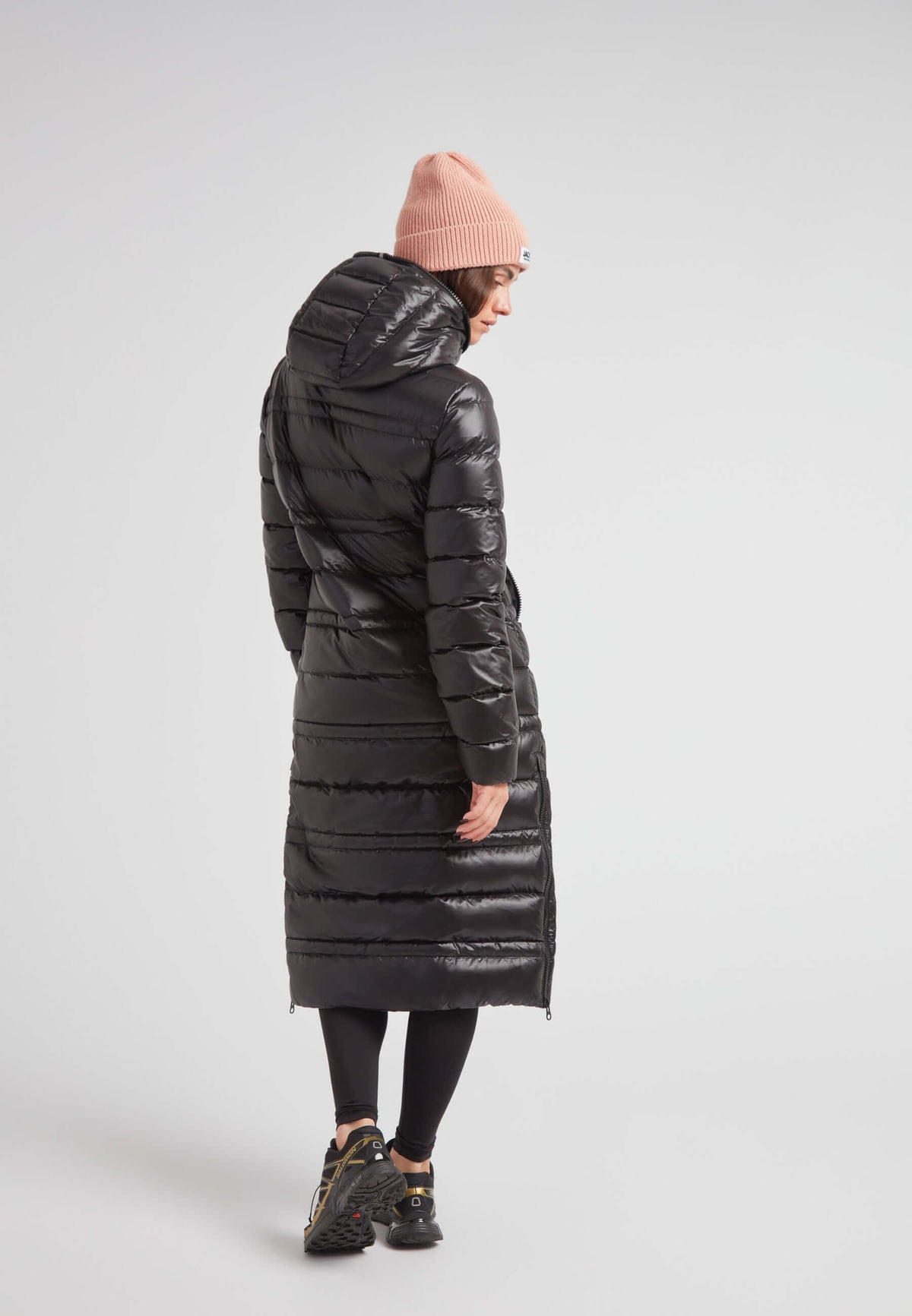 R4D Tramline Extra Long Down Coat Lux Black seen from the back, showcasing its sleek design and full-length fit.