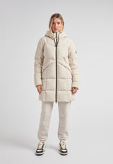 Model wearing the Black Star Puffer Down Coat Stone featuring a two-way zip and adjustable waist for winter style.