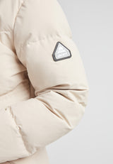 Black Star Puffer Down Coat Stone close-up of sleeve showing logo and puffy insulation detail.