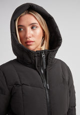 Close-up of a woman wearing the Black Star Puffer Down Coat Black with a hood, showcasing its sleek design and features.