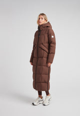 Black Star Extra Long Down Coat Matt Mid Brown displayed on a model, featuring a minimalist design and mid-brown color.