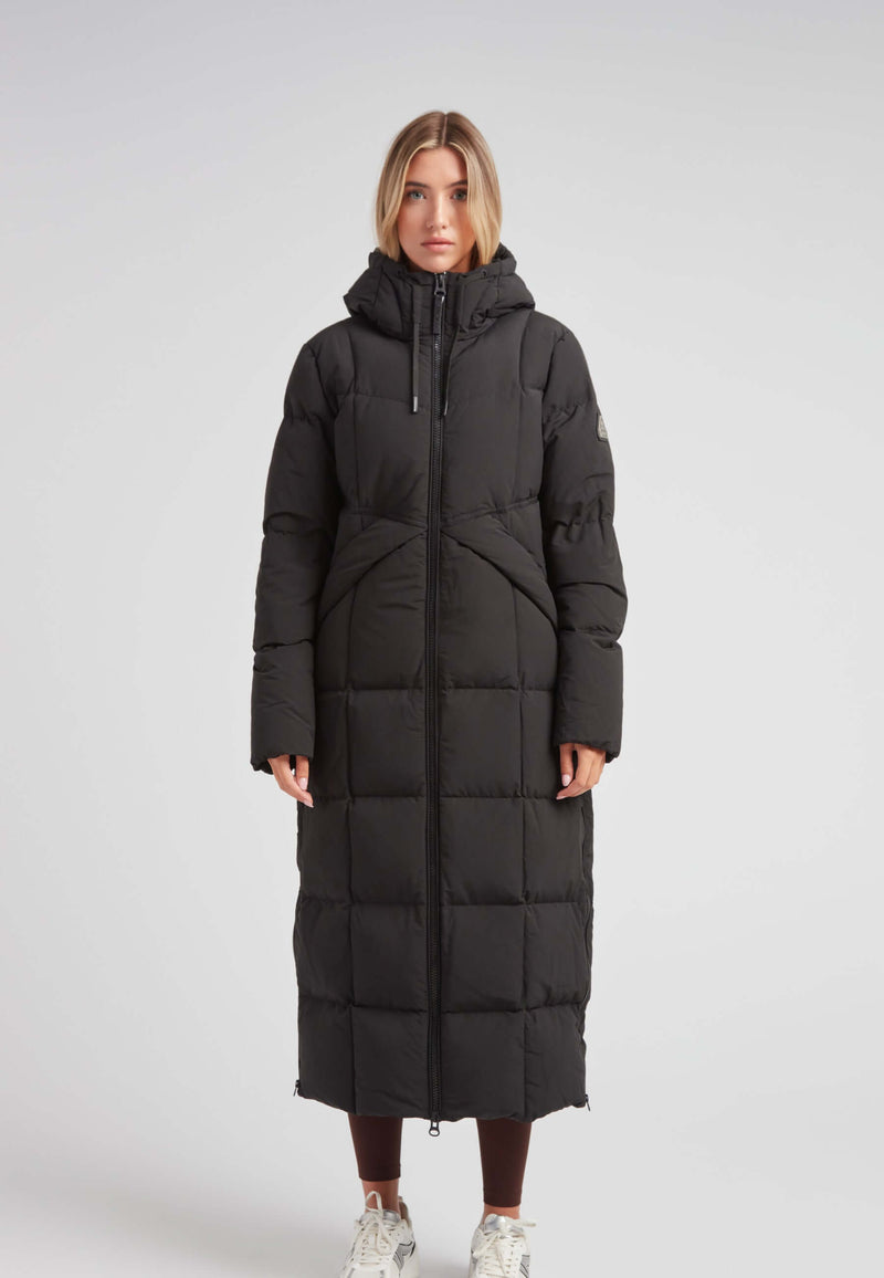 Black Star Extra Long Down Coat Matt Black on a model, showcasing a stylish, full-length, puffer design.