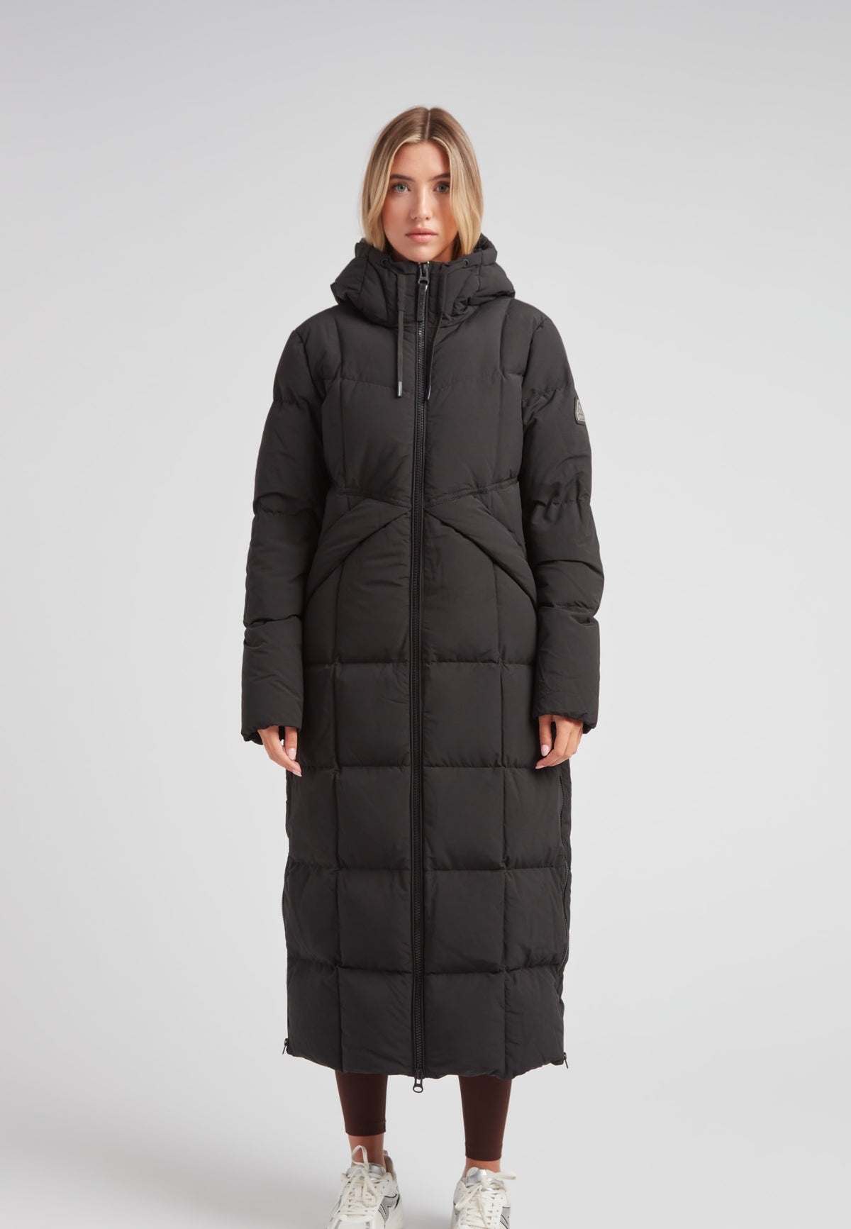 Black Star Extra Long Down Coat Matt Black on a model, showcasing a stylish, full-length, puffer design.