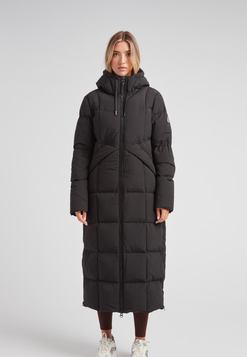 Black Star Extra Long Down Coat Matt Black on a model, showcasing a stylish, full-length, puffer design.