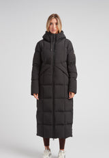 Black Star Extra Long Down Coat Matt Black on a model, showcasing a stylish, full-length, puffer design.
