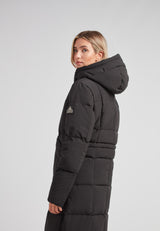 Black Star Extra Long Down Coat Matt Black showcased in profile, featuring an adjustable hood and elegant silhouette.