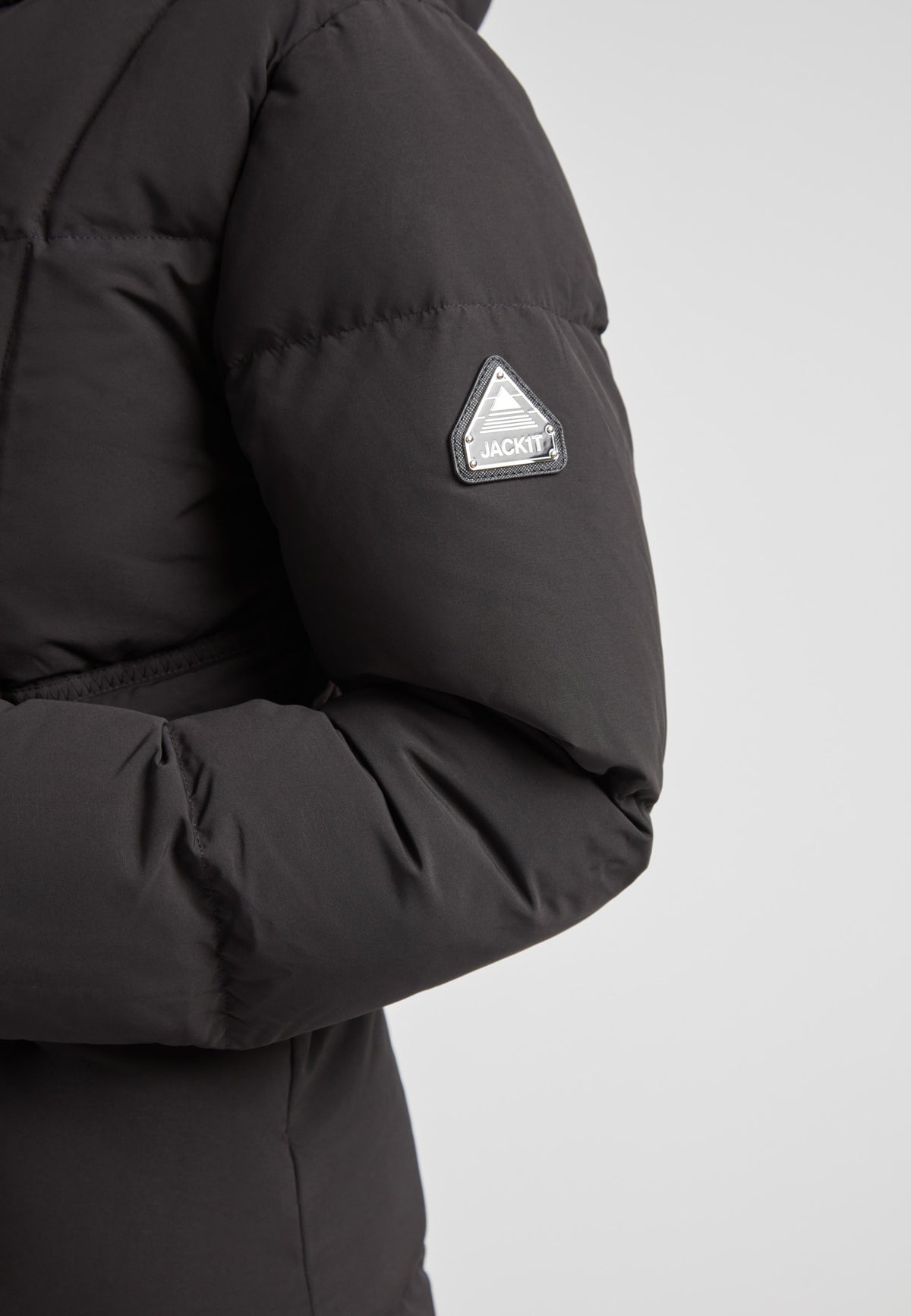 Detail of the Black Star Extra Long Down Coat Matt Black showcasing the arm area with logo.